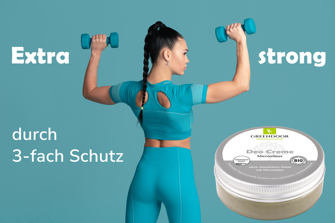 Deo Creme Microsilber Greendoor Deo Creme Microsilber mit junger Frau, die Gewichte stemmt und der Aussage Extra strong durch dreifach Schutz